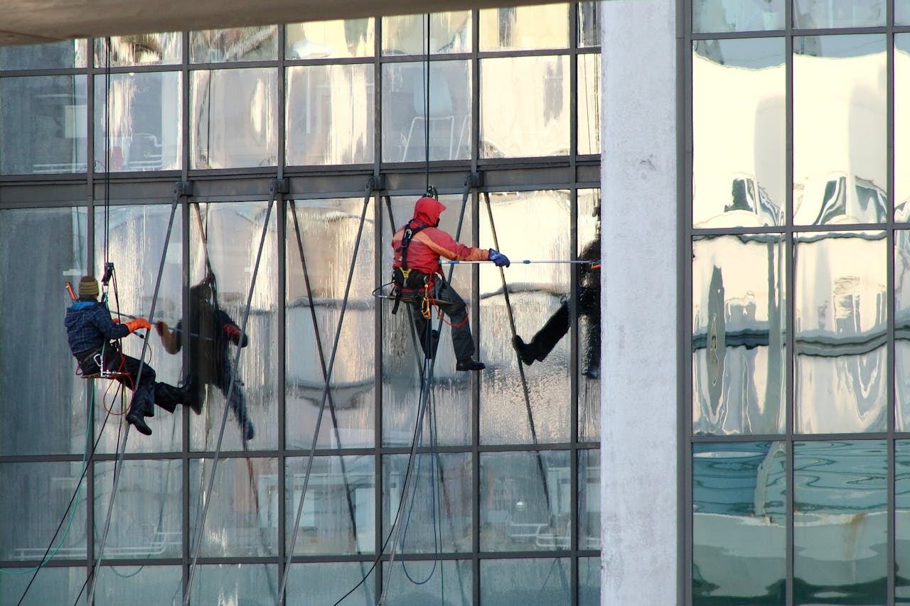services-02 Professional window cleaners working on a skyscrapers exterior in Saint Petersburg, Russia.